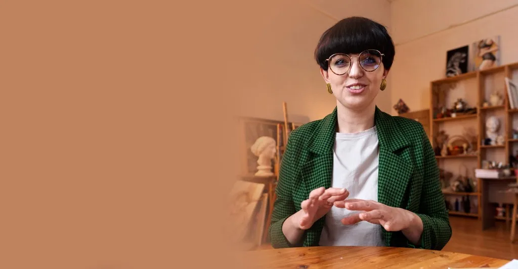 Buddy volunteer in conversation at a table